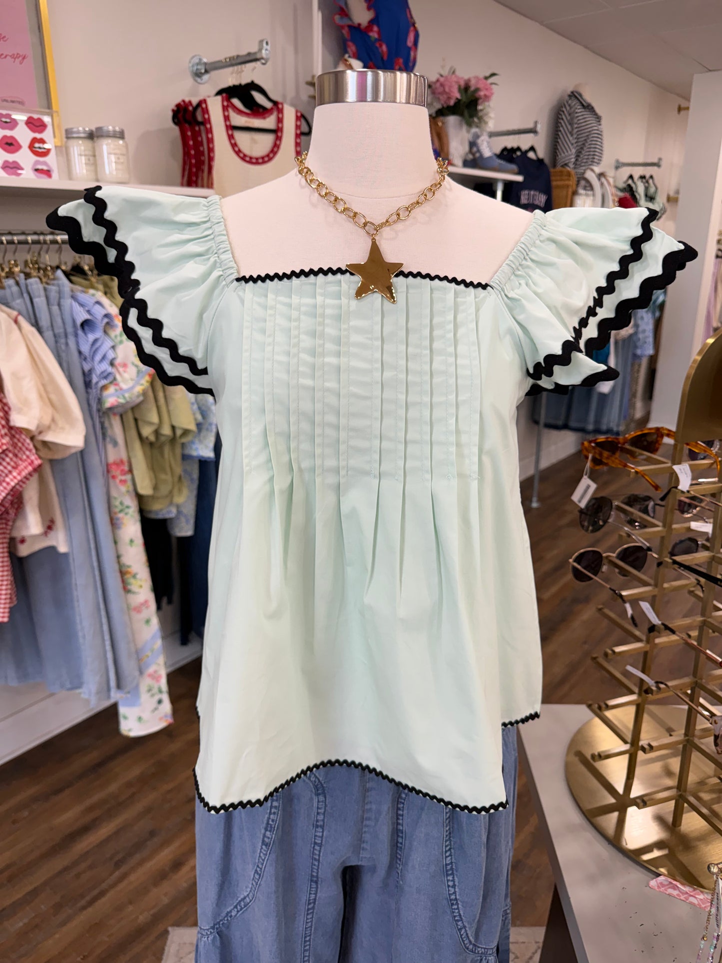 Listicle- Aqua Mint Flutter Ruffle Top